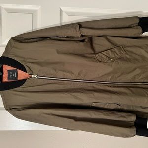 Oversized. Long. Covers butt